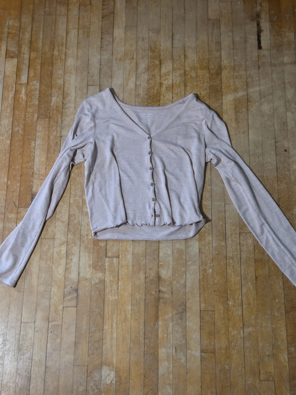 American Eagle Cropped V-Neck Ribbed Button-Front Long Sleeve Top in Light Pink